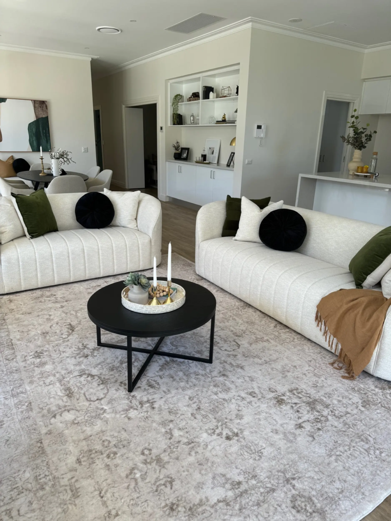 A refurbished lounge with light seating and built-in storage