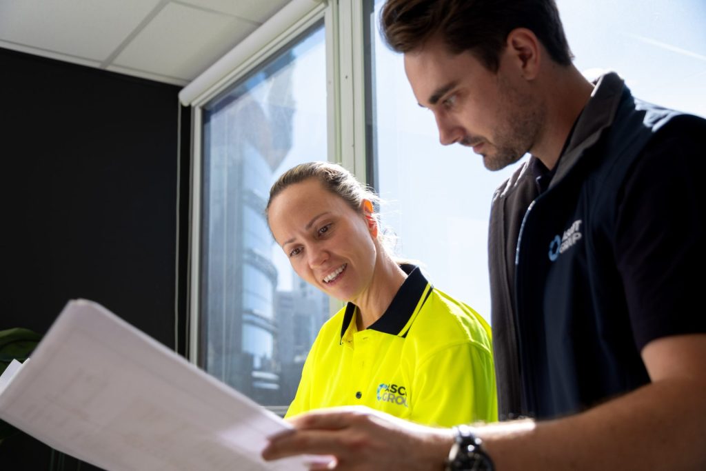 Ascot Group team members reviewing express works